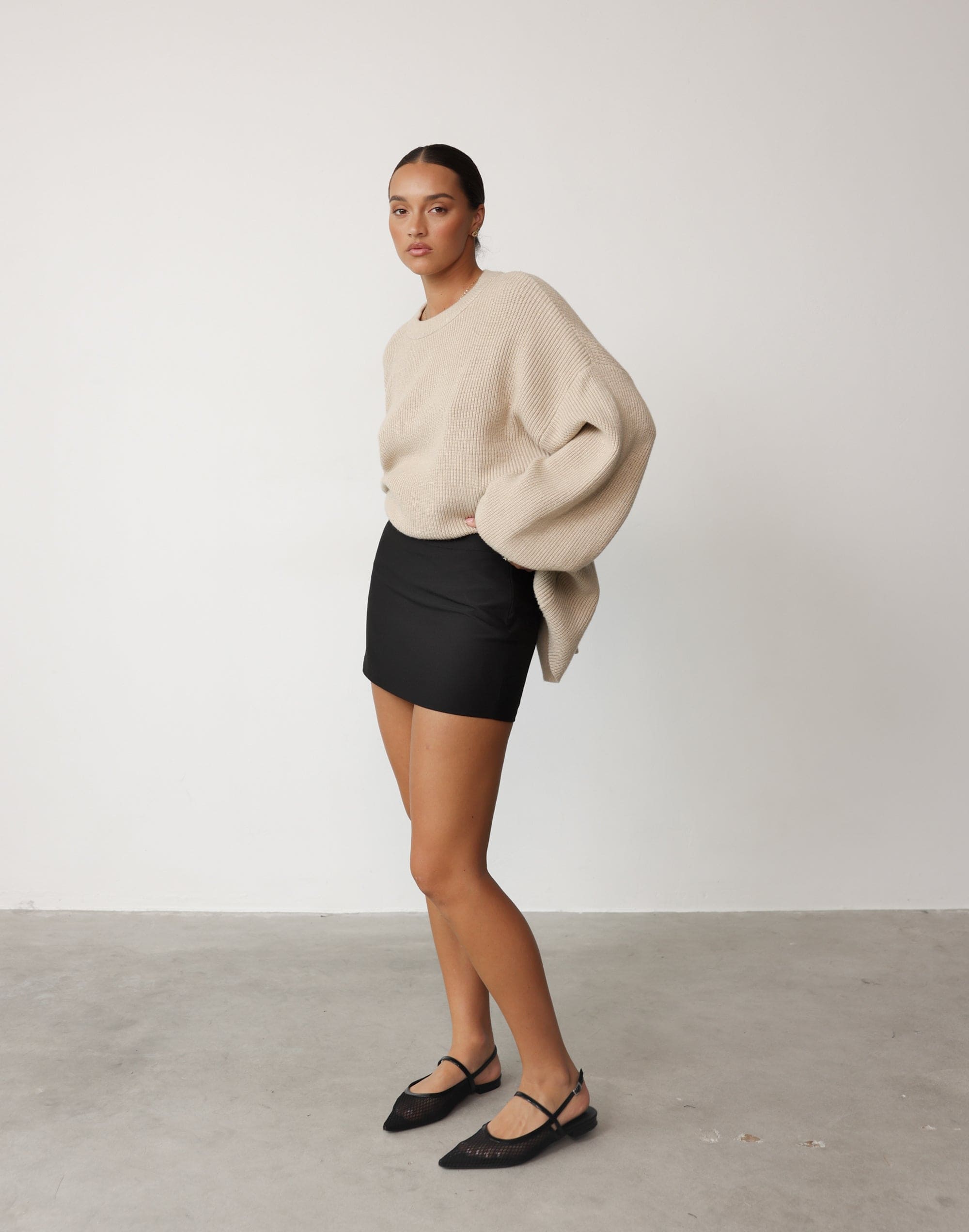 beige skirt black sweater